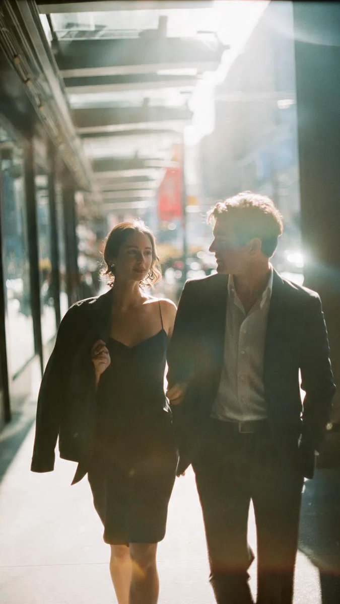 A cinematic candid medium shot portrait of a man and a wo...