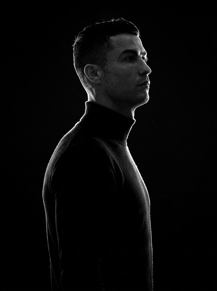 A minimalist black and white cinematic portrait featuring...